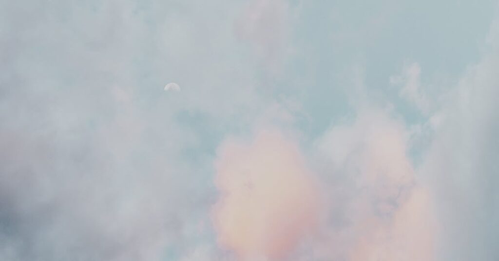 Clouds A serene scene of pastel clouds and a subtle moon in a calming sky, perfect for a peaceful backdrop.
